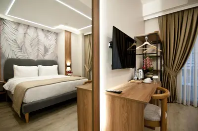 a hotel room with a bed and a desk at Forty Nişantaşı Hotel & SPA in Istanbul