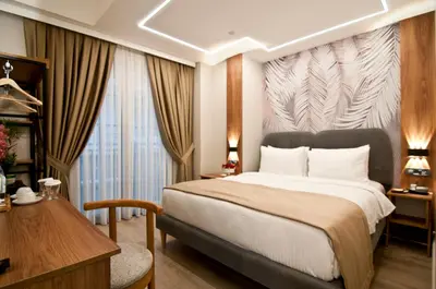 a hotel room with a bed and a desk at Forty Nişantaşı Hotel & SPA in Istanbul