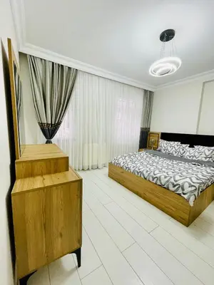 a bedroom with a bed and a dresser in it at ekinci cihangir in Istanbul