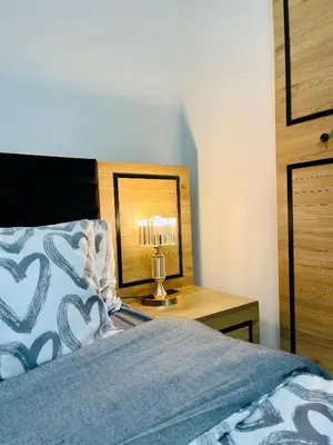 a bedroom with a bed and a table with a lamp at ekinci cihangir in Istanbul