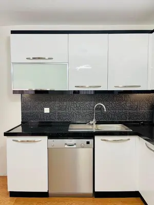 a kitchen with white cabinets and a sink at ekinci cihangir in Istanbul