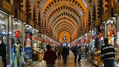a group of people walking through a shopping mall at otel efendi in Istanbul
