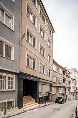 a building on a street with a car parked in front at Samuray in Istanbul