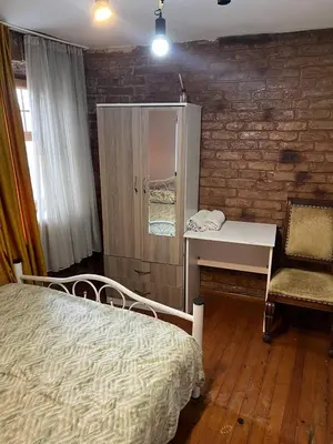 a bedroom with a bed and a desk and a chair at suite near Taksim square in Istanbul