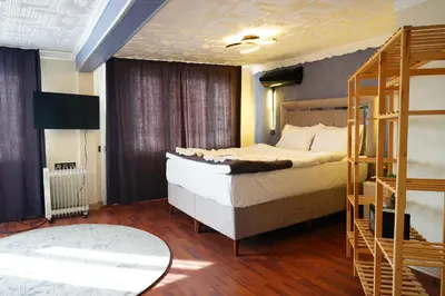 a bedroom with a bed and a bunk ladder at the apart galata in Istanbul