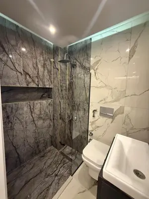 a bathroom with a shower and a toilet and a sink at Modern Compact Studio Near Metro Station in Istanbul