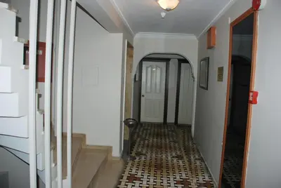 a hallway with a tile floor in a house at Hotel Grand Mark in Istanbul