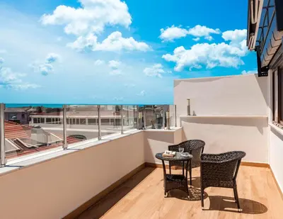 a balcony with two chairs and a table with a view at Kupeli Hotel in Istanbul