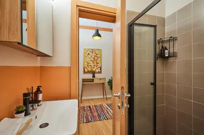 a bathroom with a sink and a shower at Prime Nişantaşı 2BR Flat 3-Min Walk to Metro in Istanbul