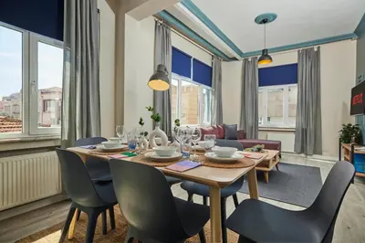 a dining room with a table and chairs at Central Nişantaşı Stay 2BR Flat AC in All Rooms in Istanbul