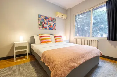 a bedroom with a bed and a window at Central 4-Bedroom House with Private Terrace and 2 Bathrooms in Istanbul