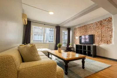 a living room with a couch and a coffee table at Central 4-Bedroom House with Private Terrace and 2 Bathrooms in Istanbul