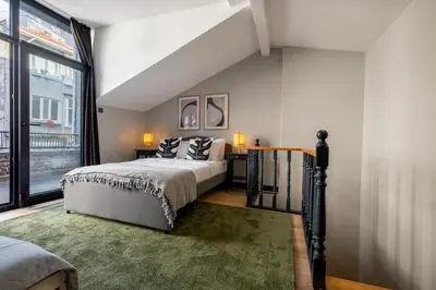 a bedroom with a bed and a large window at Central 4-Bedroom House with Private Terrace and 2 Bathrooms in Istanbul