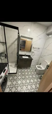 a bathroom with a shower and a toilet and a sink at nişanesi sita in Istanbul