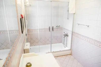a bathroom with a shower and a sink at Terrazzo Sapanca - Isıtmalı Havuzlu Villa Süha Fazlı in Sapanca