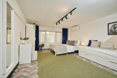 a living room with two beds and a couch at Stunning Combo Flat in Nisantasi in Istanbul