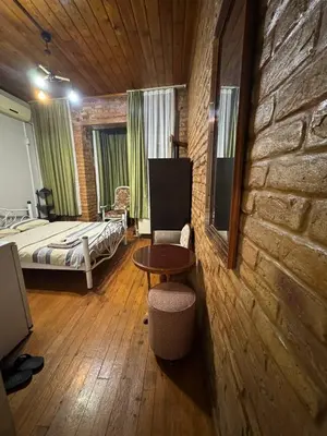 a bedroom with a bed and a table in a room at Naila ahmadreza in Istanbul