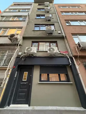 a tall building with windows and a door at Bright & Modern 2-Bedroom Flat Near Metro in Istanbul
