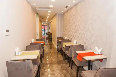 a dining room with tables and chairs in a restaurant at Park Grazza Hotel in Istanbul