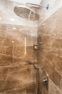 a bathroom with a shower with a shower head at Park Grazza Hotel in Istanbul