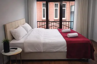 a bed with two pillows on it in a bedroom at balatlife suites in Istanbul