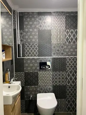 a bathroom with a toilet and a sink at KMC City Hotel in Lüleburgaz