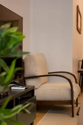 a living room with a chair and a table at 3-Bedroom 2-Bathroom, Centrally Located Ground-Floor Apartment -No Stairs in Istanbul