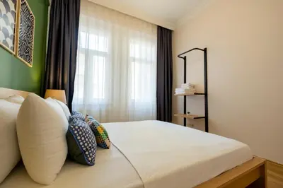 a bedroom with a white bed with a window at 3-Bedroom 2-Bathroom, Centrally Located Ground-Floor Apartment -No Stairs in Istanbul