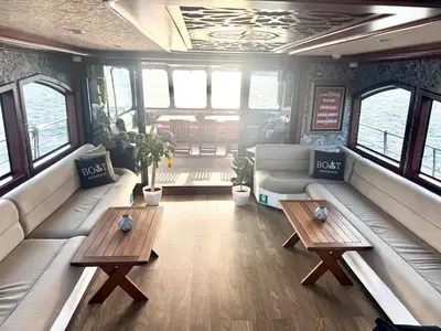 a living room with couches and tables in a boat at Boat BOSPHORUS in Istanbul