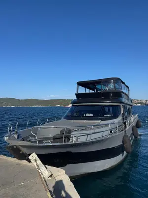 a boat is docked at a dock in the water at Boat BOSPHORUS in Istanbul