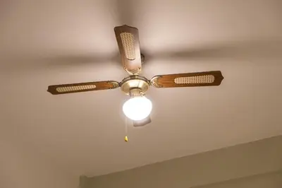 a ceiling fan with a light on a ceiling at Fully Renovated 2BR Flat in Center of Moda in Istanbul