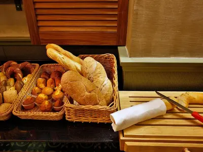 two baskets of bread and pastries on a counter at Sanat Boutique Hotel Pera in Istanbul