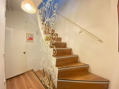 a staircase with a metal design on the wall at Unique 4-Level Home in the Heart of Beşiktaş in Istanbul