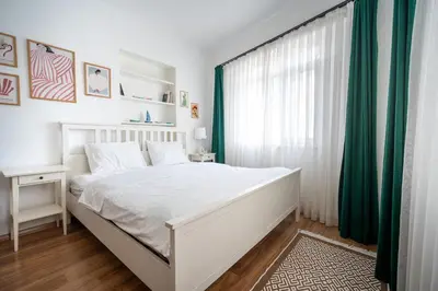 a bedroom with a white bed and a window at Unique 4-Level Home in the Heart of Beşiktaş in Istanbul