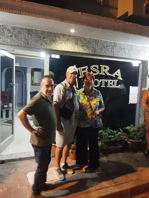 a group of three men standing in front of a store at İSTANBUL ESRA Hotel in Istanbul
