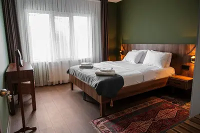 a bedroom with a bed with two towels on it at Terrazzo Sapanca - Isıtmalı Havuzlu Villa Sole in Sapanca