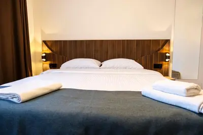a large bed with two towels on top of it at Terrazzo Sapanca - Isıtmalı Havuzlu Villa Sole in Sapanca