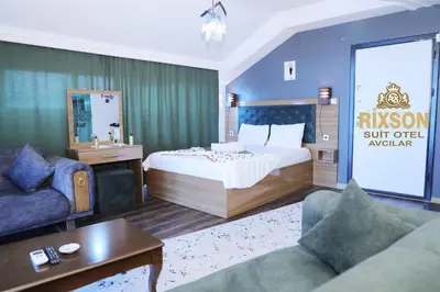 a hotel room with a bed and a couch at Riwaner Hotel in Avcılar
