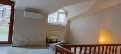 a small room with a bed and a window at Sağlam Apartments 1 in Istanbul
