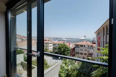 a view of a city from a window at Sea View Two-Bedroom Suite in Managed Residence - Parking and Elevator in Istanbul