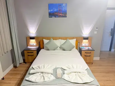 a bedroom with a large bed with two night stands at Taksim Historical Yellow Hotel in Istanbul