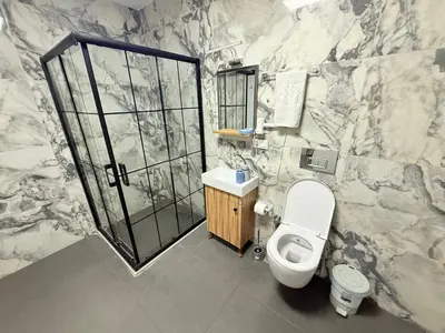 a bathroom with a white toilet and a sink at Taksim Historical Yellow Hotel in Istanbul