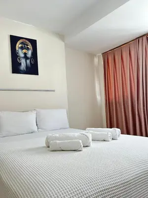 two white beds in a room with a window at Apartment with a View Taksim-Beyoğlu1 in Istanbul
