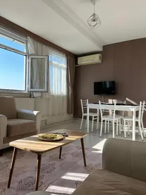 a living room with a table and a dining room at Apartment with a View Taksim-Beyoğlu1 in Istanbul