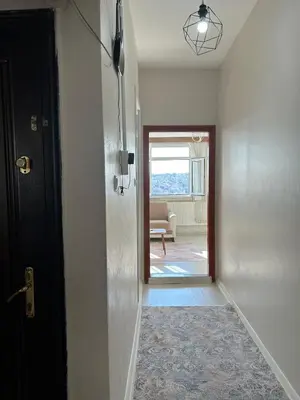 a hallway with a door leading to a living room at Apartment with a View Taksim-Beyoğlu1 in Istanbul