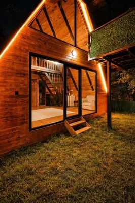 a house with a large window on the side of it at Alyüz Bungalov in Sapanca