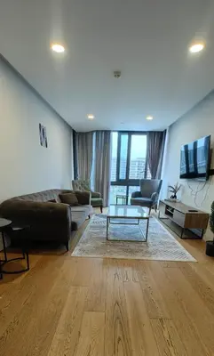a living room with a couch and a table at Apartment at Prime Istanbul in Istanbul