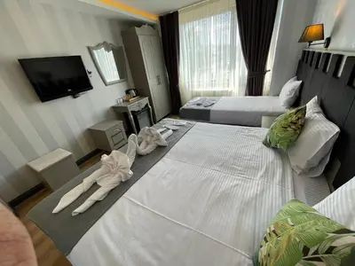 a hotel room with two beds and towels at Old City Viva Hotel in Istanbul