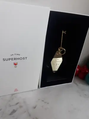a gold key in a black box with a necklace at Newly-renovated apartment 1 in Istanbul