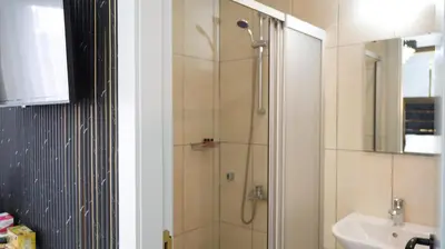 a bathroom with a shower and a sink at Taksim Armoni Hotel in Istanbul